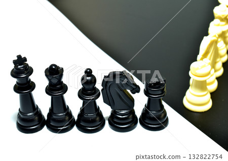 Black and white chess pieces. 132822754
