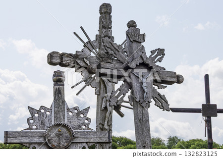 Ornate crucifixes at the Hill of Crosses, Lithuania, with intricate carvings Ornate crucifixes at the Hill of Crosses, Lithuania, with intricate carvings 132823125