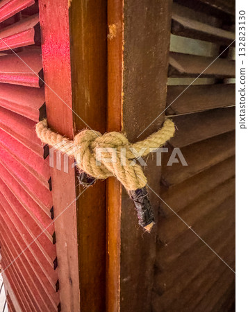 Strong Rope Knot on Wooden Shutters Rustic Detail and Texture 132823130