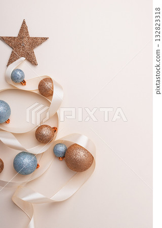 Minimalist Christmas Tree Made of Ribbon and Ornaments on Light Background Minimalist Christmas Tree Made of Ribbon and Ornaments on Light Background 132823318