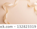 Elegant Satin Ribbon on Beige Background for Festive Design 132823319