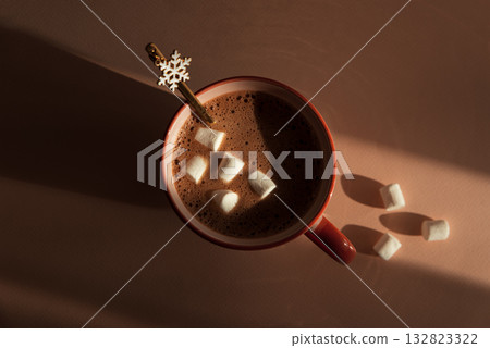 Hot Chocolate with Marshmallows and Snowflake Spoon in Pink Mug Hot Chocolate with Marshmallows and Snowflake Spoon in Pink Mug 132823322