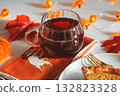 Autumn Table Setting with Pumpkin Pie, Hot Drink, and Seasonal Decor 132823328