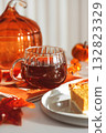 Autumn Table Setting with Pumpkin Pie, Hot Drink, and Seasonal Decor 132823329