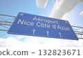 Bright blue motorway indicator toward Nice Cote dAzur Airport with jetliner gliding toward the runway, arriving to Nice, France. 3D rendering 132823671