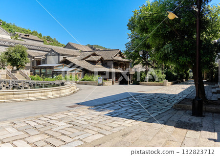 The ancient water town of Gubei near the site of the Great Wall of Simatai on a clear summer day. 132823712