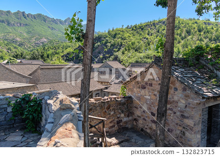 The ancient water town of Gubei near the site of the Great Wall of Simatai on a clear summer day. 132823715