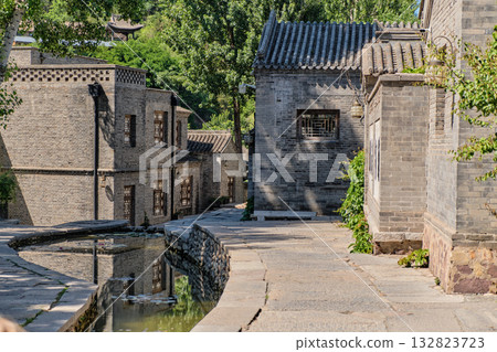 The ancient water town of Gubei near the site of the Great Wall of Simatai on a clear summer day. The ancient water town of Gubei near the site of the Great Wall of Simatai on a clear summer day. 132823723