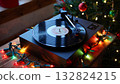 Cozy christmas scene featuring vinyl record playing on turntable, surrounded by warm festive lights, holiday decor and sense of nostalgic warmth 132824215