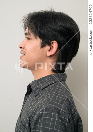 Portrait of handsome Young Asian Thai man face profile against white background Portrait of handsome Young Asian Thai man face profile against white background 132824706