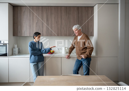 Angry upset woman scolding husband conflict in old couple at home. Confrontation, emotional baggage 132825114