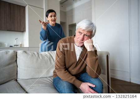Enraged woman berates husband feel exhaustion under constant verbal assault. Angry wife screaming 132825164