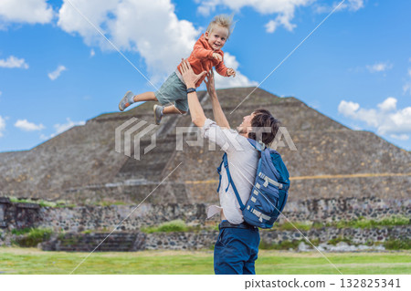 Father with his little toddler son as tourists in front of the pyramids of Teotihuacan in Mexico, enjoying sightseeing, family bonding, and cultural heritage Father with his little toddler son as tourists in front of the pyramids of Teotihuacan in Mexico, enjoying sightseeing, family bonding, and cultural heritage 132825341