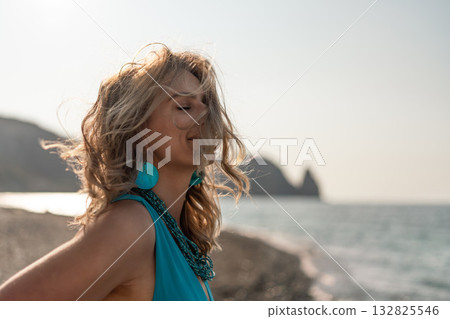 Woman beach freedom, beautiful blonde enjoying summer vacation by ocean breeze with eyes closed in peaceful nature. Woman beach freedom, beautiful blonde enjoying summer vacation by ocean breeze with eyes closed in peaceful nature. 132825546