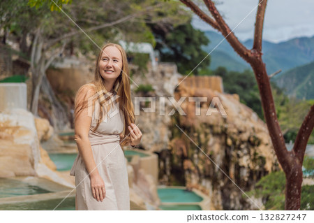 Female tourist exploring Grutas Tolantongo in Mexico, enjoying natural hot springs, scenic caves, and outdoor adventure. Travel, wellness, and sightseeing concept 132827247