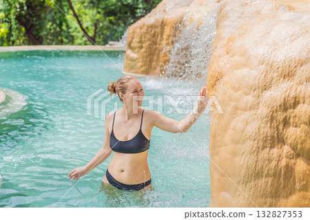 Female tourist exploring Grutas Tolantongo in Mexico, enjoying natural hot springs, scenic caves, and outdoor adventure. Travel, wellness, and sightseeing concept Female tourist exploring Grutas Tolantongo in Mexico, enjoying natural hot springs, scenic caves, and outdoor adventure. Travel, wellness, and sightseeing concept 132827353
