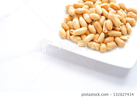 Peanuts - Delicious salty butter peanuts, perfect as a snack with alcohol Peanuts - Delicious salty butter peanuts, perfect as a snack with alcohol 132827414