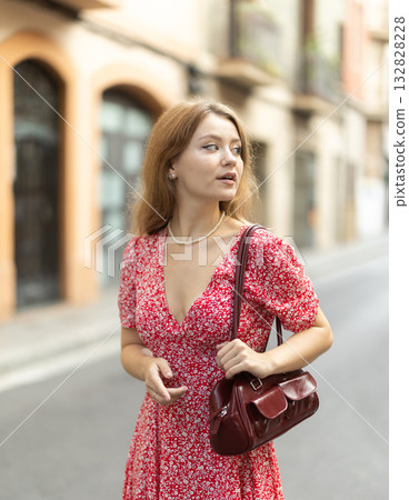 Young woman walking around city Young woman walking around city 132828228