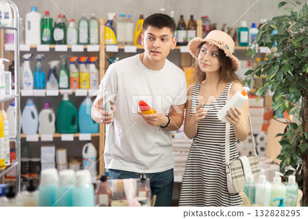 Couple view trademark sign on label, pick eco friendly sunblock cream Couple view trademark sign on label, pick eco friendly sunblock cream 132828295