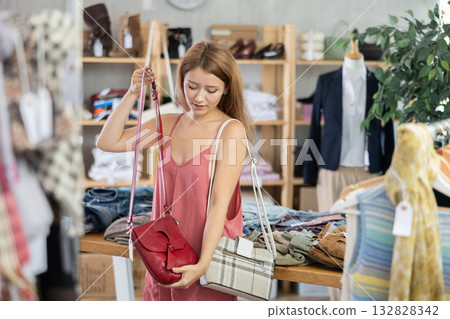 Woman choosing a handbag in a store 132828342