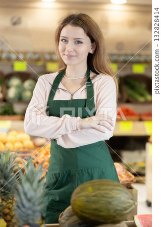 Young woman seller in vegetable shop 132828414