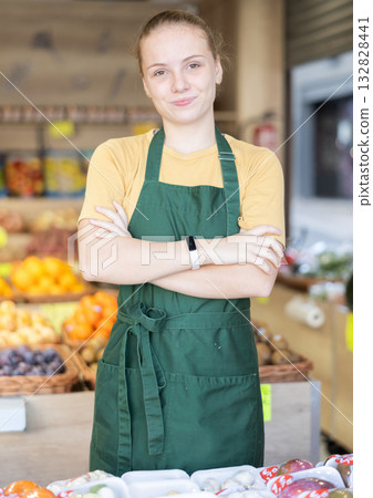 Female salesman standing in grocery store Female salesman standing in grocery store 132828441