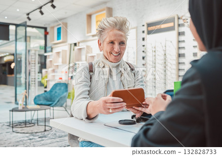 Eye care, senior woman and glasses for patient shopping for vision lens or frame at optics store. Happy customer person talking to service consultant for decision on optometry case choice for eyes 132828733