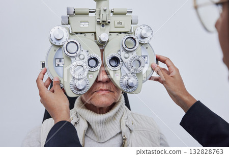 Eyes, vision exam and senior woman with optometrist in clinic for test, eyesight and optical assessment. Optometry, healthcare and optician with elderly patient, phoropter lens and medical machine 132828763