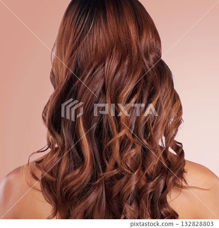 Beauty, back and hair care of woman in studio isolated on a red background for haircare. Curly hairstyle, keratin cosmetics and female model with salon treatment for growth, texture and balayage. 132828803
