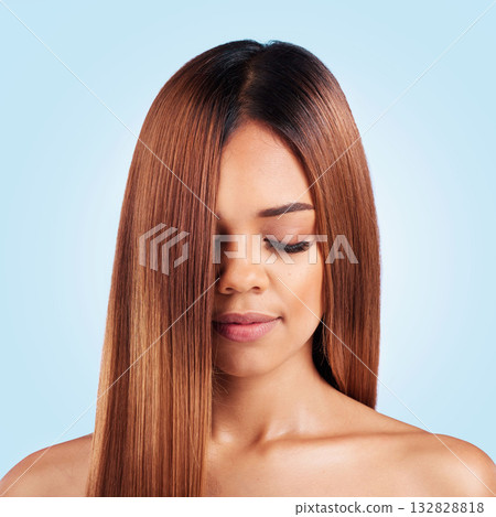 Beauty, hair care and face of woman with eyes closed in studio isolated on a blue background. Makeup cosmetics, wellness and young female model with salon treatment for growth, hairstyle or balayage. 132828818