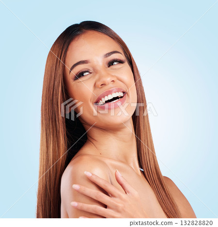 Beauty, face and hair care of woman in studio isolated on a blue background. Makeup cosmetics, skincare thinking and happy female model laughing with salon treatment for growth, hairstyle or balayage Beauty, face and hair care of woman in studio isolated on a blue background. Makeup cosmetics, skincare thinking and happy female model laughing with salon treatment for growth, hairstyle or balayage 132828820