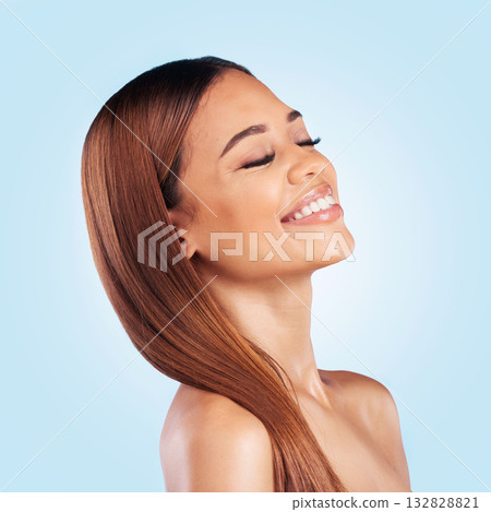 Face, beauty and hair care of woman with eyes closed in studio isolated on a blue background. Makeup cosmetics, skincare and happy female model with salon treatment for growth, hairstyle and balayage 132828821