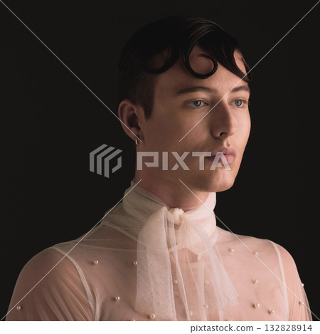 Gender neutral, fashion face and vintage aesthetic with designer clothing and faux pearls in studio. Isolated, black background and lgbtq or gay gen z with jewelry and creativity and non binary art Gender neutral, fashion face and vintage aesthetic with designer clothing and faux pearls in studio. Isolated, black background and lgbtq or gay gen z with jewelry and creativity and non binary art 132828914