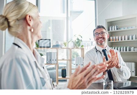 Doctors, applause and support with medical success for team building or collaboration in healthcare at hospital. Happy, celebrate or winner for health achievement, medicine research or promotion 132828979