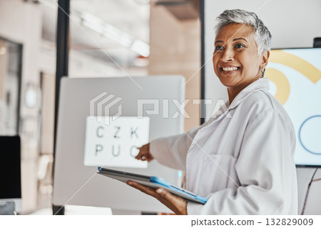 Healthcare, optometrist and woman with tablet, workshop and discussion for research, vision and smile. Medical professional, female presenter and lady with device, innovation for eyecare and wellness 132829009