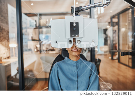 Optometry, eye exam and black woman for vision, healthcare test and optical assessment for glasses. Ophthalmology, optometrist clinic and patient with medical equipment, phoropter and lens for eyes 132829011