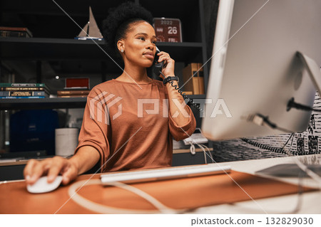 Telephone, office and business woman on computer working on corporate project while on call. Professional, career and African female employee doing research on desktop for company report in workplace Telephone, office and business woman on computer working on corporate project while on call. Professional, career and African female employee doing research on desktop for company report in workplace 132829030
