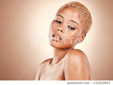 Beauty, skincare and black woman in studio with mockup and luxury cosmetics with product placement for glowing skin. Natural makeup, spa facial and advertising aesthetic on model on brown background. Beauty, skincare and black woman in studio with mockup and luxury cosmetics with product placement for glowing skin. Natural makeup, spa facial and advertising aesthetic on model on brown background. 132829041