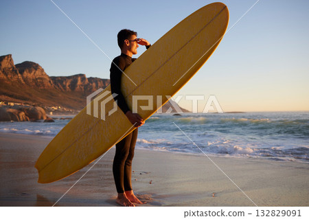 Surfer, man and beach with looking, waves and hand by eyes for safety from sun, thinking or planning morning. Ocean athlete, surfboard or water for fitness, sports and tropical adventure for exercise 132829091