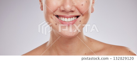 Face smile, dental and teeth of woman in studio isolated on a gray background. Skincare makeup, cosmetics and lips, mouth and oral hygiene of happy female model with veneers, invisalign and wellness. Face smile, dental and teeth of woman in studio isolated on a gray background. Skincare makeup, cosmetics and lips, mouth and oral hygiene of happy female model with veneers, invisalign and wellness. 132829120