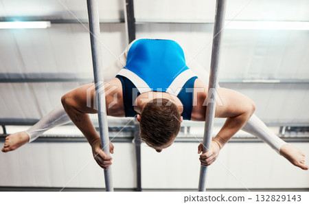 Gymnastics man, bars and training with balance, strong body and focus for sports, vision and professional career. Gymnast, athlete and exercise with muscle development, workout and low angle at gym Gymnastics man, bars and training with balance, strong body and focus for sports, vision and professional career. Gymnast, athlete and exercise with muscle development, workout and low angle at gym 132829143