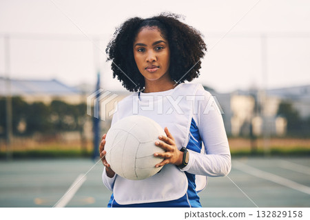 Sports, netball and portrait of a woman with a ball after a match, exercise or training on the court. Confidence, fitness and female captain athlete standing on field after game, workout or practice. 132829158