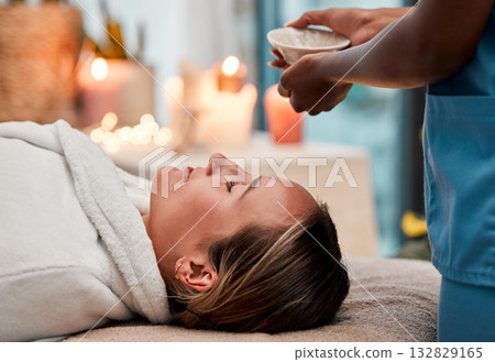 Beauty, skincare and woman getting a face massage with oil for self care, cosmetic and self care. Health, spa and female doing a luxury facial treatment for glowing and healthy skin by wellness salon Beauty, skincare and woman getting a face massage with oil for self care, cosmetic and self care. Health, spa and female doing a luxury facial treatment for glowing and healthy skin by wellness salon 132829165