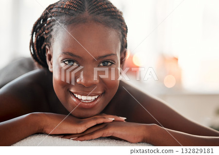 Spa, portrait and black woman with smile, massage and salon luxury treatment, bare and lying on table. Face, African American female and lady with happiness, relax and healing therapy for wellness Spa, portrait and black woman with smile, massage and salon luxury treatment, bare and lying on table. Face, African American female and lady with happiness, relax and healing therapy for wellness 132829181
