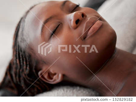 Black woman face, relax and luxury spa treatment of a young female ready for facial. Skincare, beauty and wellness clinic with client feeling calm and zen before massage or cosmetic chemical peel 132829182
