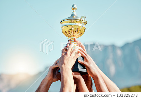 Sports, champion and hands of team with trophy for achievement, goal and success together. Celebration, winner and people holding an awards cup after winning a sport competition or rugby tournament 132829278