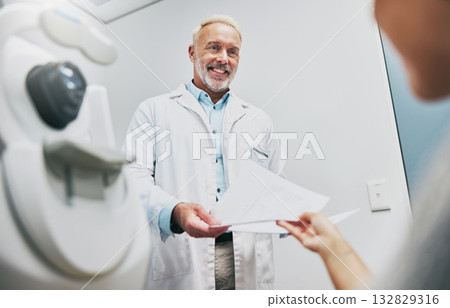 Ophthalmology, consulting and doctor with a patient for results, vision help and surgery information. Healthcare, communication and mature ophthalmologist talking to a woman about advice on eyes Ophthalmology, consulting and doctor with a patient for results, vision help and surgery information. Healthcare, communication and mature ophthalmologist talking to a woman about advice on eyes 132829316