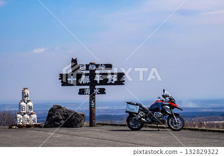A motorcycle with the Tokachi Plain in the background A motorcycle with the Tokachi Plain in the background 132829322