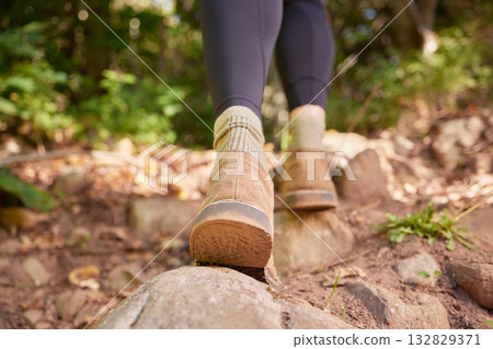 Ground, woman shoes and hiking in forest, nature and rock path for wellness, exercise and outdoor adventure. Hiker girl, boots and freedom in woods, forrest and walk to explore landscape on holiday 132829371