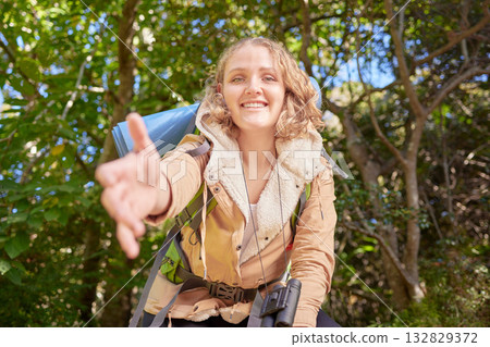 Woman hiking, nature portrait and helping hand pov with happiness, goal or outdoor adventure in summer. Happy hiker girl, free and smile in sunshine, woods or forest on walk with backpack on holiday 132829372